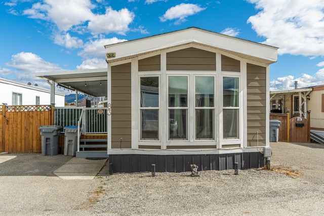 Beautifully Maintained Single Wide Mobile Home With A Spacious Addition & Large Covered Deck!  3 Bedrooms & 2 Baths